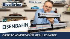 Youtube: Diesellokomotive USA grau-schwarz mit Personenwagen von BlueBrixx