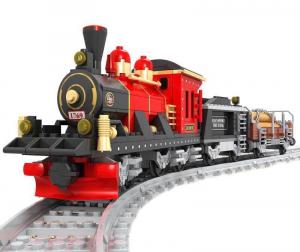Rote Dampflokomotive mit Tender und offenem Güterwagen