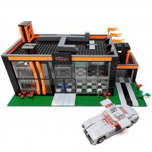 Autohaus und Werkstatt mit Auto