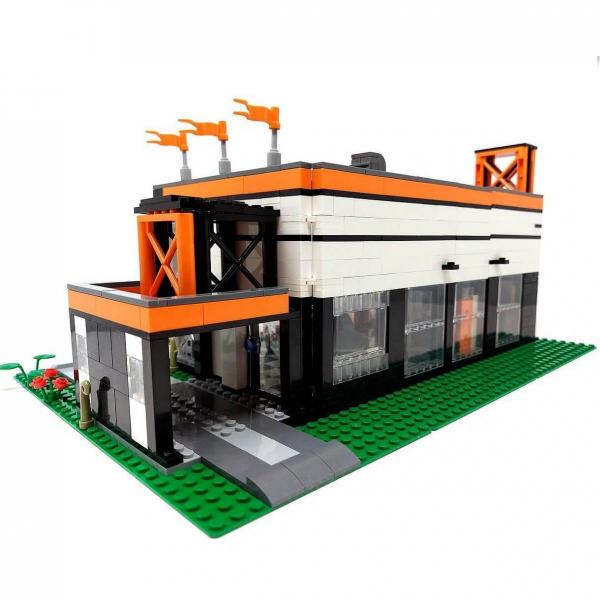 Autohaus und Werkstatt mit Auto