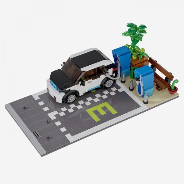 Parkplatz mit Ladesäule und Auto